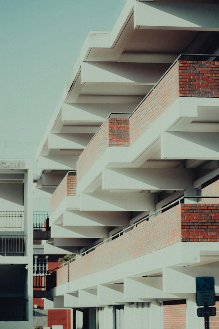 Photo of a contemporary building with a geometric facade and brick exterior.