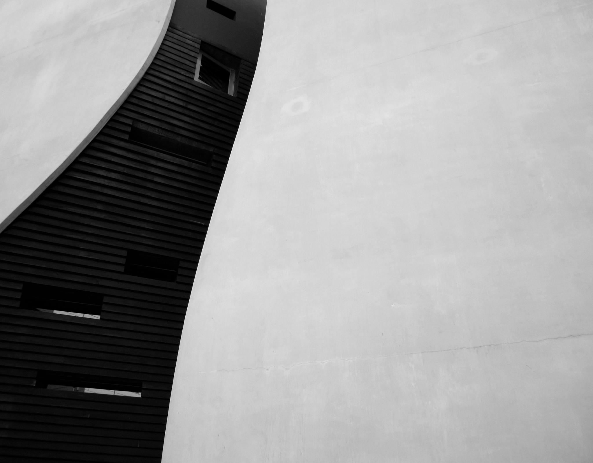 Stylish abstract view of modern building architecture captured in black and white.